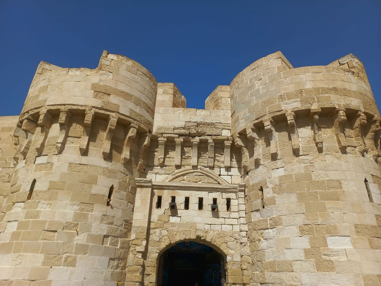 The stone towers of the Citadel of Qaitbay on Alexandria's harbour