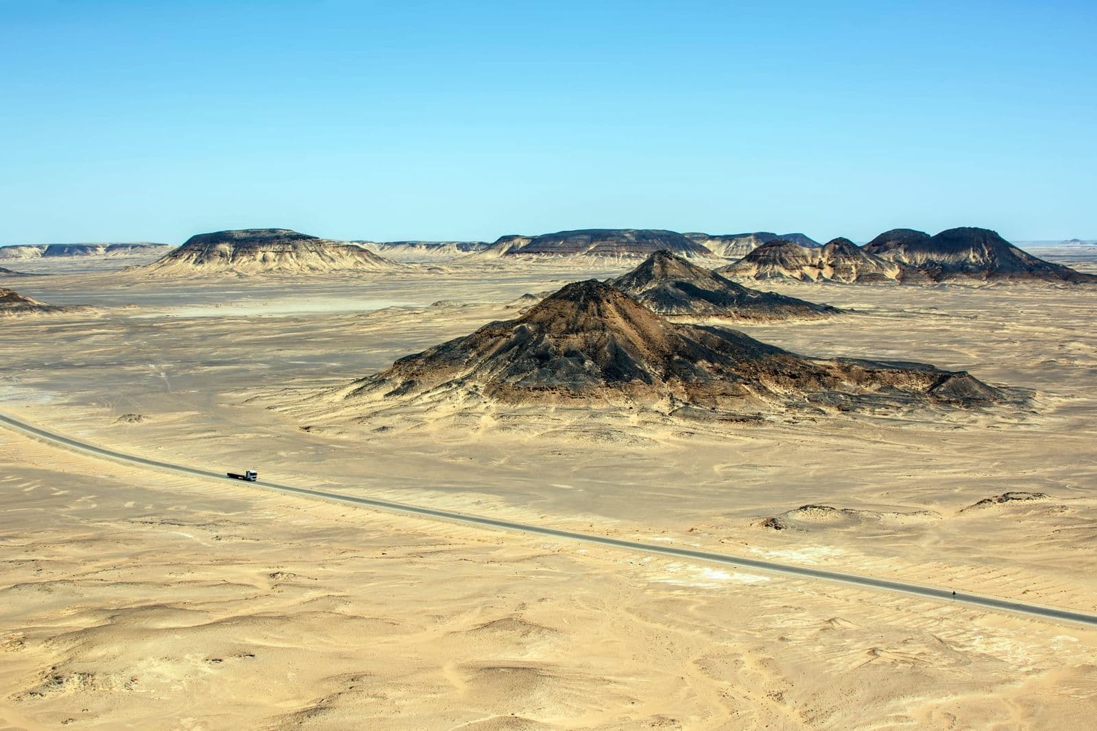 The road through the volcanic hills of the Black Desert near Bahariya