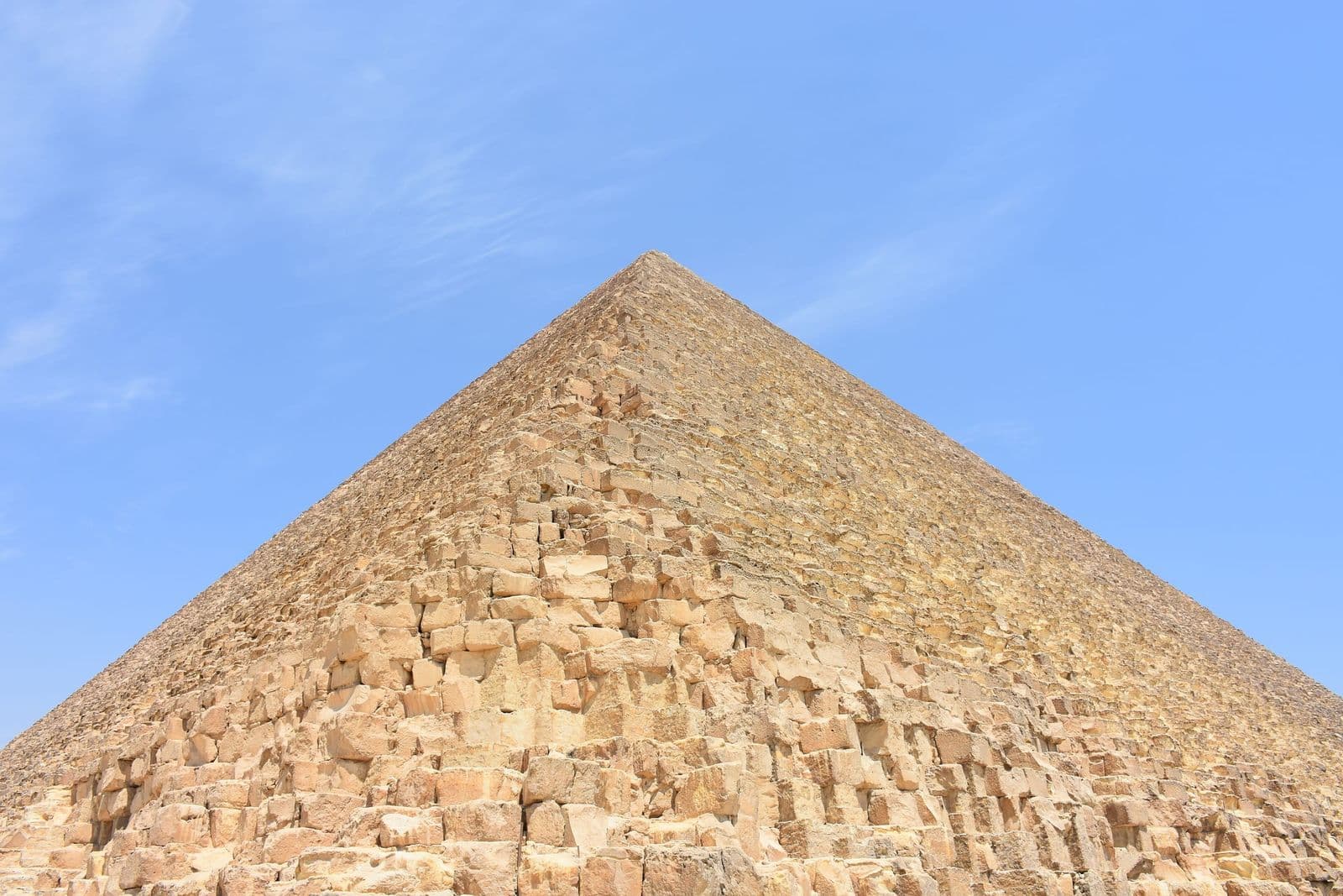 Looking up the limestone blocks of the Great Pyramid of Giza