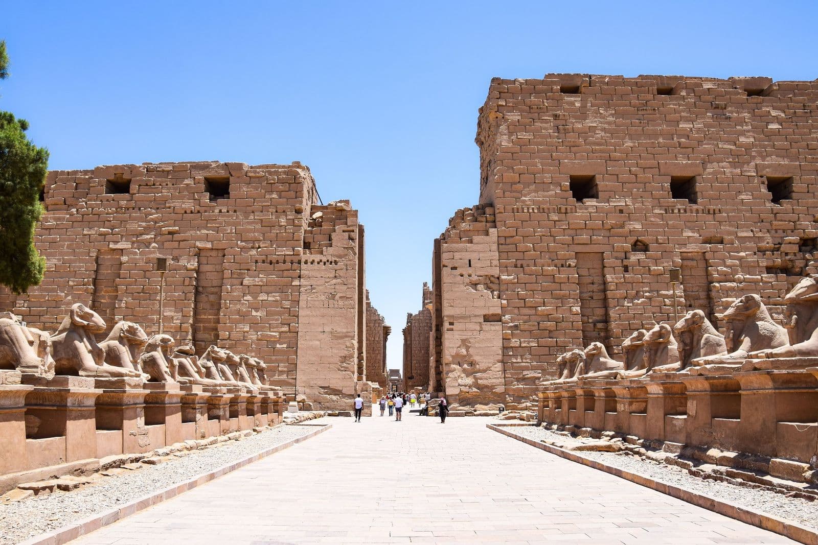 Avenue of ram-headed sphinxes leading to the first pylon of Karnak Temple