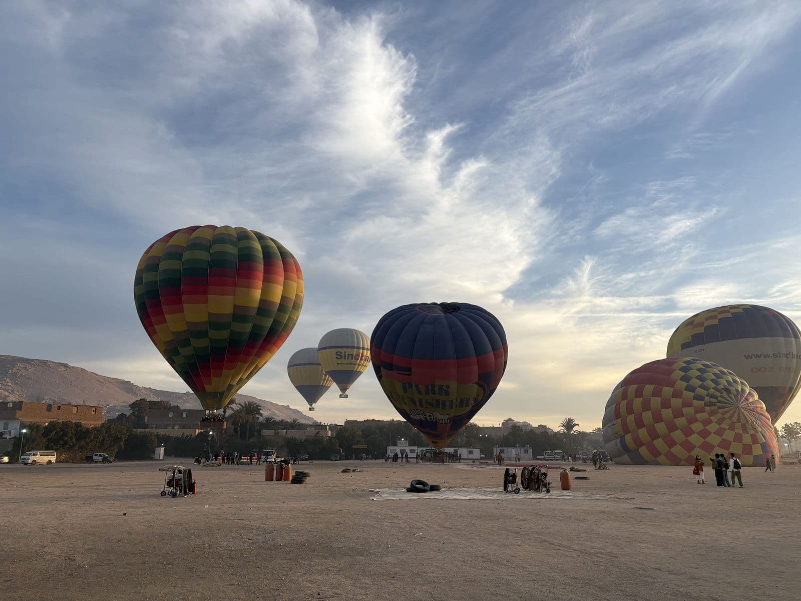 Balloons inflating for a sunrise flight on Luxor's West Bank