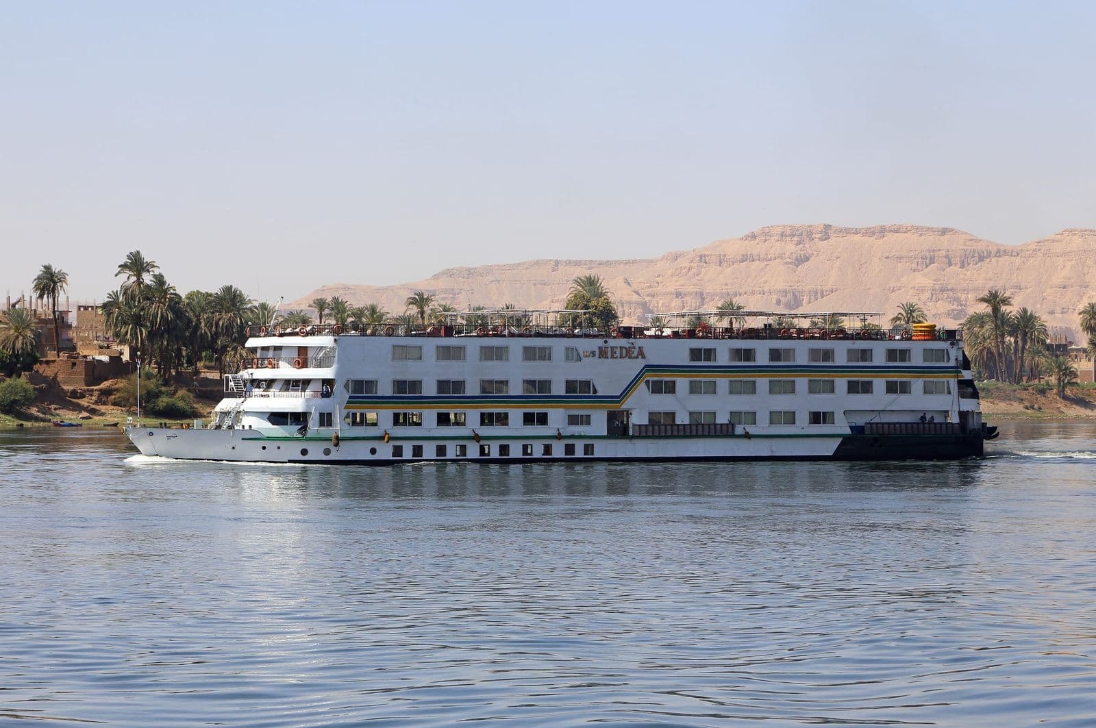 A white Nile cruise ship on the river near Luxor's West Bank