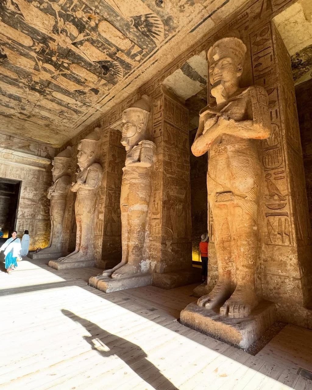 Sunlit Osiris pillars inside the Great Temple of Abu Simbel