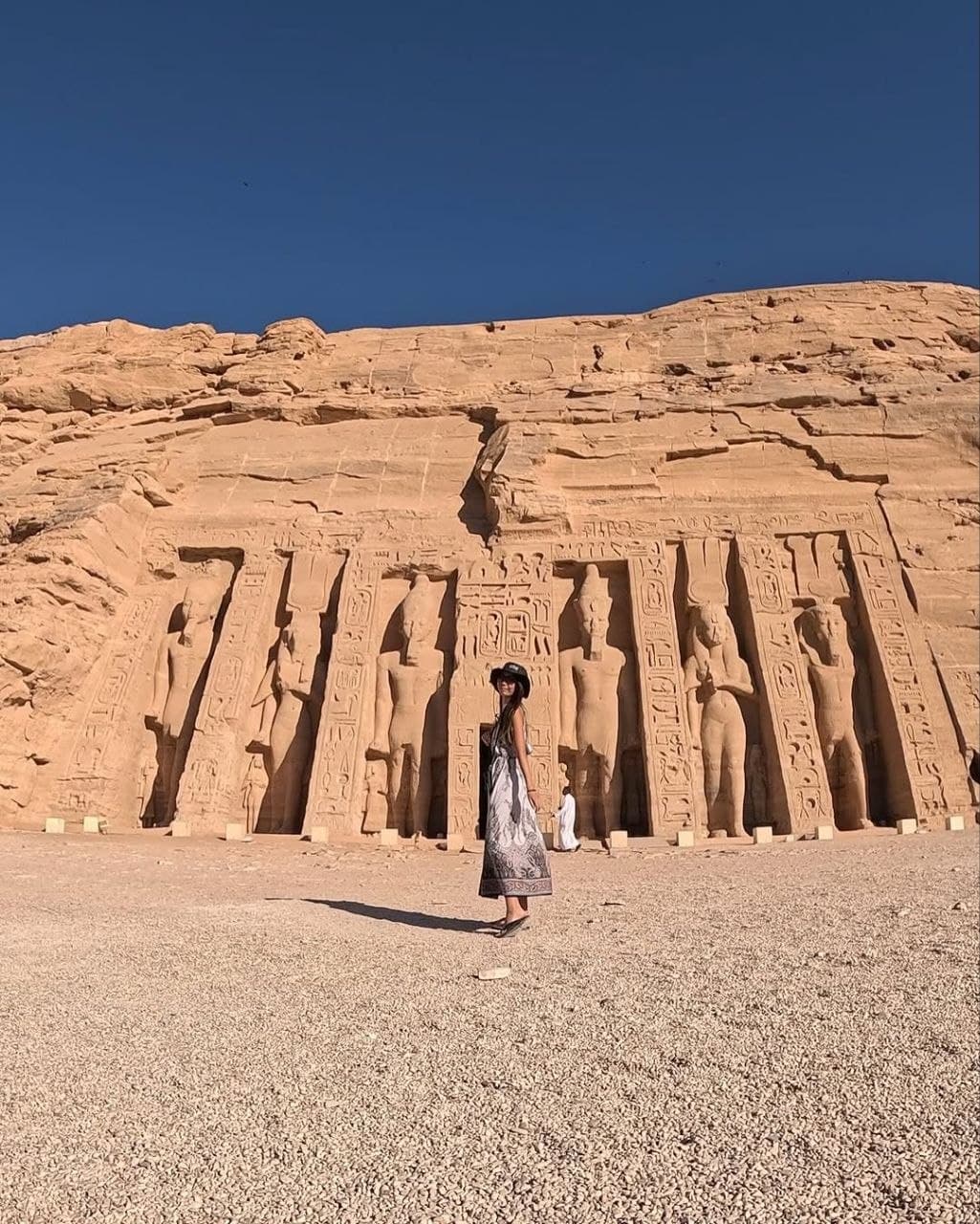 A traveler in front of Queen Nefertari's temple at Abu Simbel