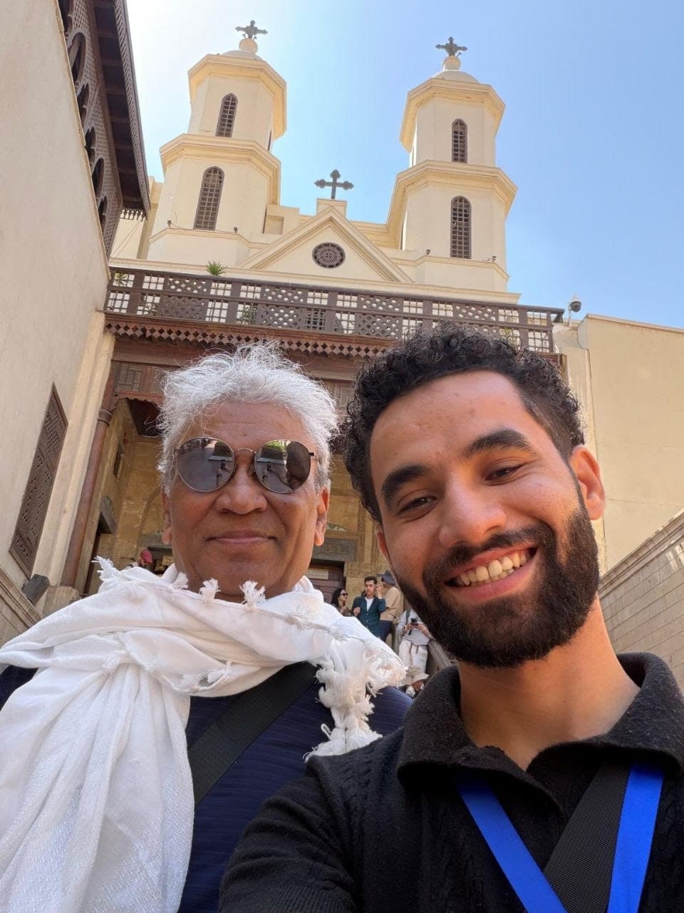 Amr with a traveler outside the Hanging Church in Coptic Cairo