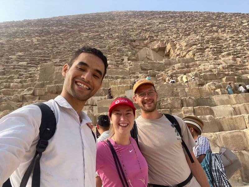 Amr with two travelers at the foot of the Great Pyramid