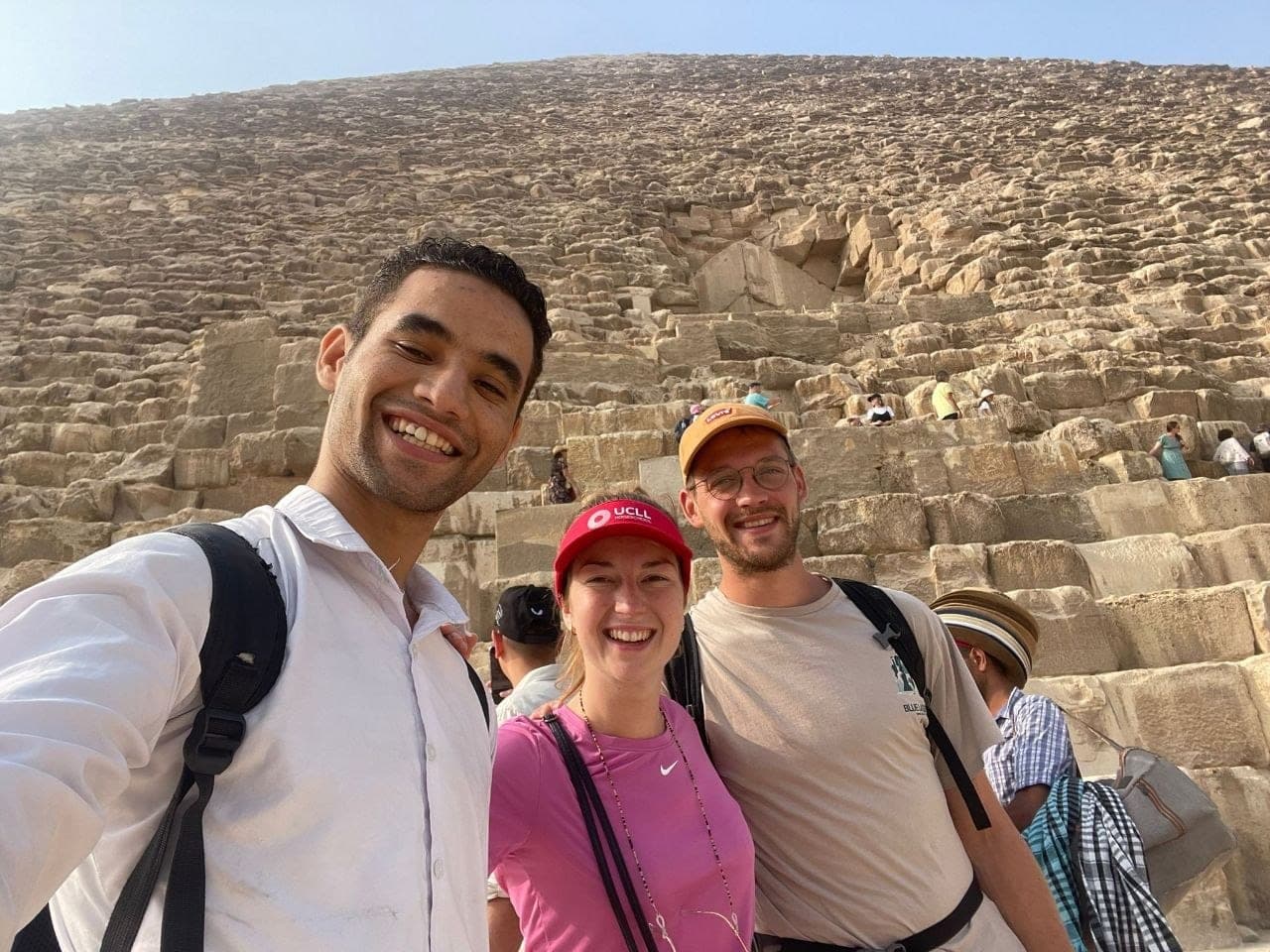 Amr with two travelers at the foot of the Great Pyramid