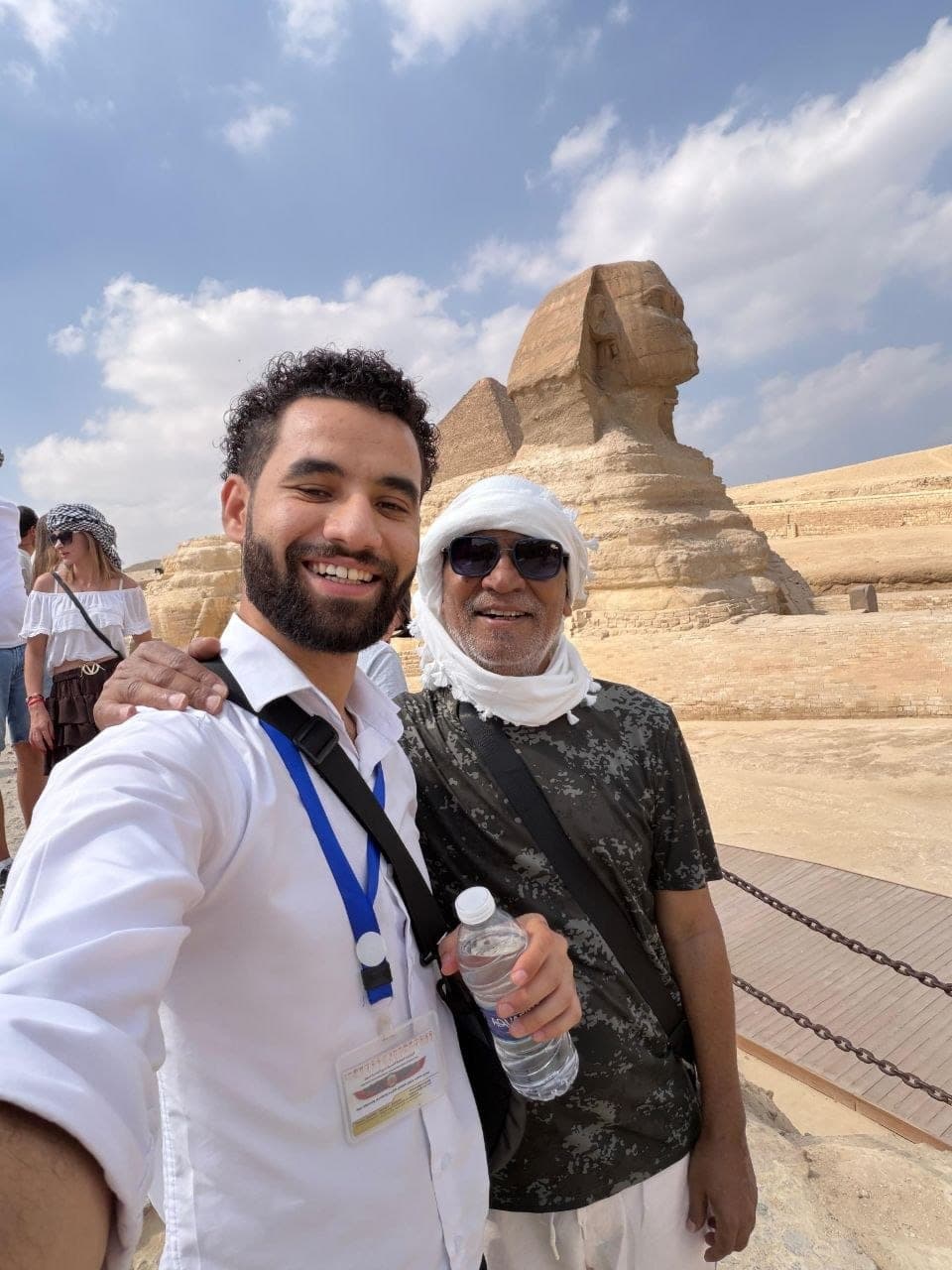 Amr with a traveler in front of the Great Sphinx