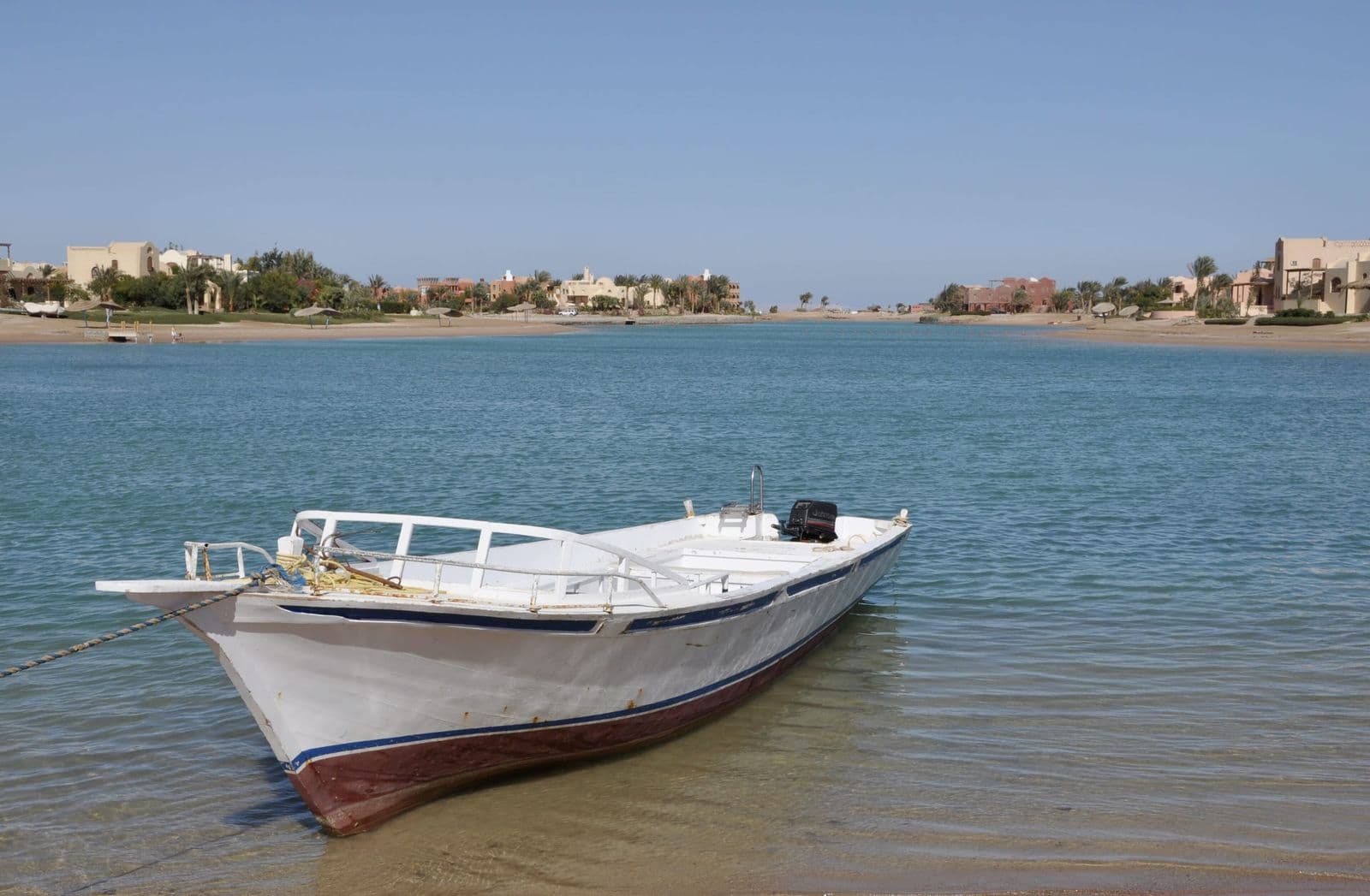 A small boat in a clear lagoon at El Gouna on the Red Sea