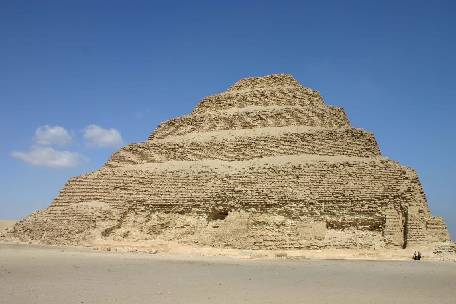 The Step Pyramid of Djoser at Saqqara under a deep blue sky