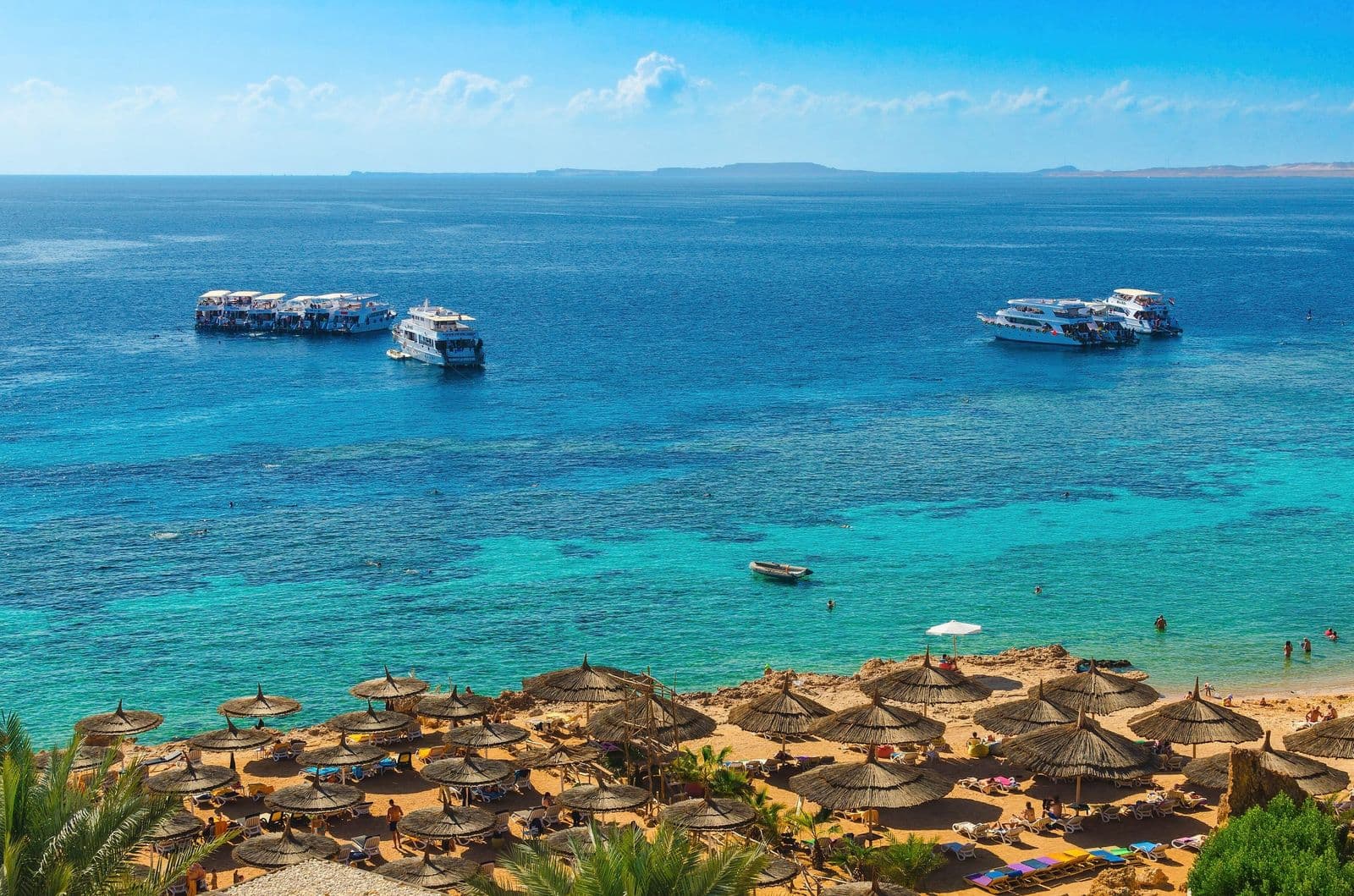 Turquoise water and boats at Ras Um Sid, Sharm El Sheikh