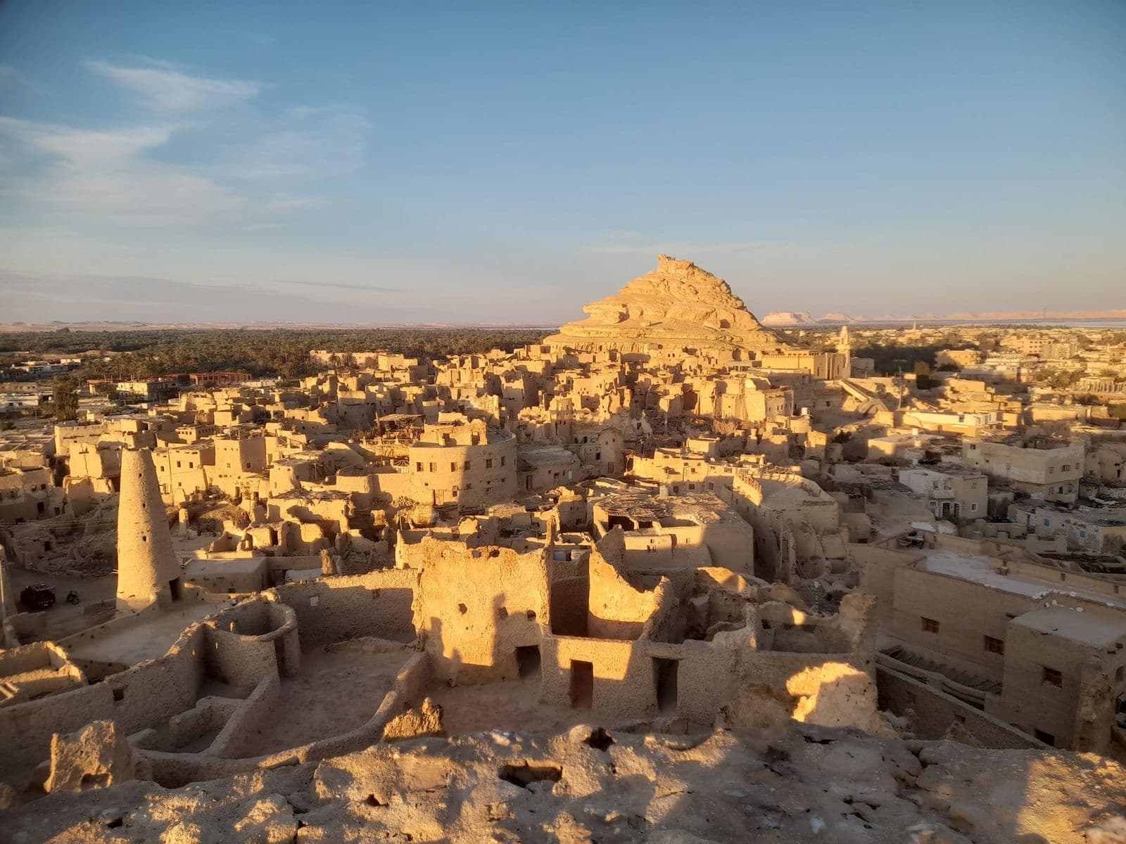 The mud-brick town of Shali in Siwa glowing in the evening light