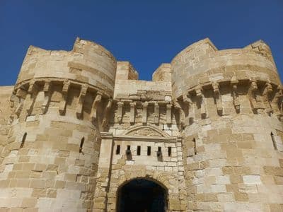 The stone towers of the Citadel of Qaitbay on Alexandria's harbour