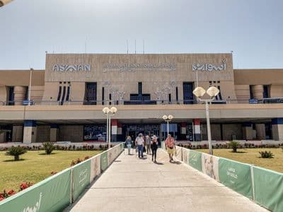 Travelers walking out of the terminal at Aswan International Airport