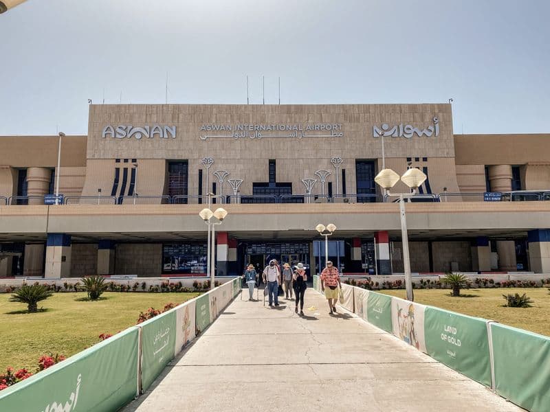 Travelers walking out of the terminal at Aswan International Airport
