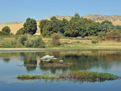 Calm water and green islands on the Nile at Aswan