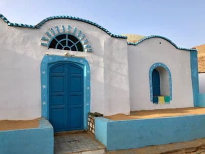 A white and blue painted Nubian house in Gharb Soheil, Aswan
