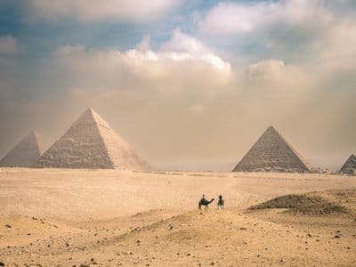 The Great Sphinx with the Pyramid of Khafre behind it on a sunny day