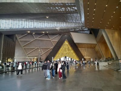 The bright entrance hall of the Grand Egyptian Museum near the pyramids