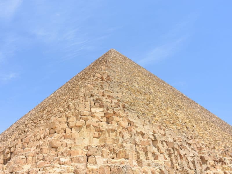 Looking up the limestone blocks of the Great Pyramid of Giza