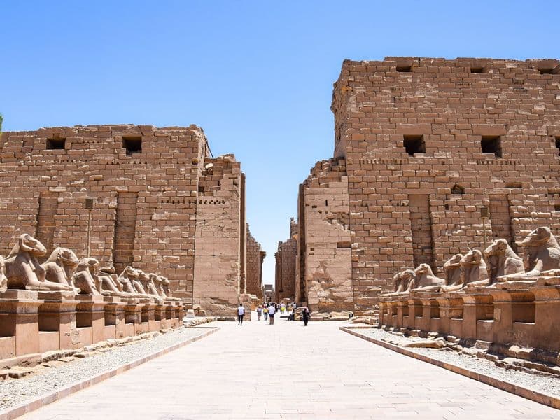 Avenue of ram-headed sphinxes leading to the first pylon of Karnak Temple