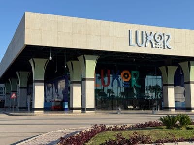 The modern terminal of Luxor International Airport, with its large LUXOR sign