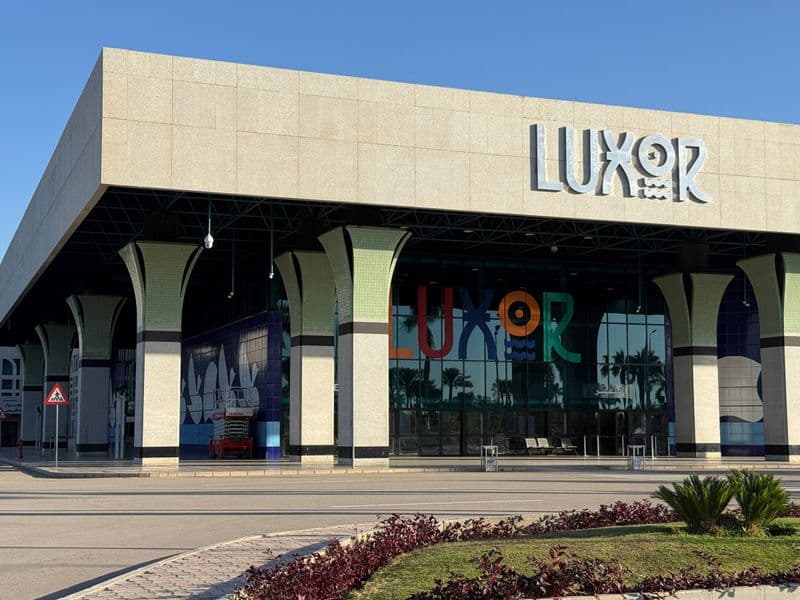 The modern terminal of Luxor International Airport, with its large LUXOR sign