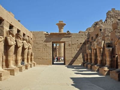 Statues of Ramesses II lining a court inside Karnak Temple