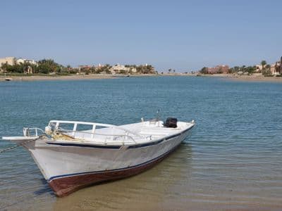 A small boat in a clear lagoon at El Gouna on the Red Sea