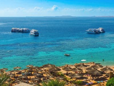 Turquoise water and boats at Ras Um Sid, Sharm El Sheikh