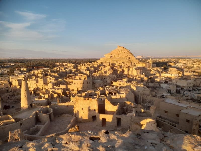 The mud-brick town of Shali in Siwa glowing in the evening light